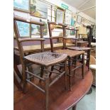 Three distressed early 20th century bergere seated chairs