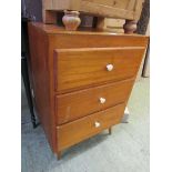 A mid-20th century ply chest of three drawers