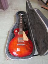 An Epiphone Les Paul electric guitar in hard case, serial number 199010182 No apparent damage,