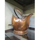 A brass and copper coal scuttle