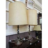 A pair of brass columned table lamps