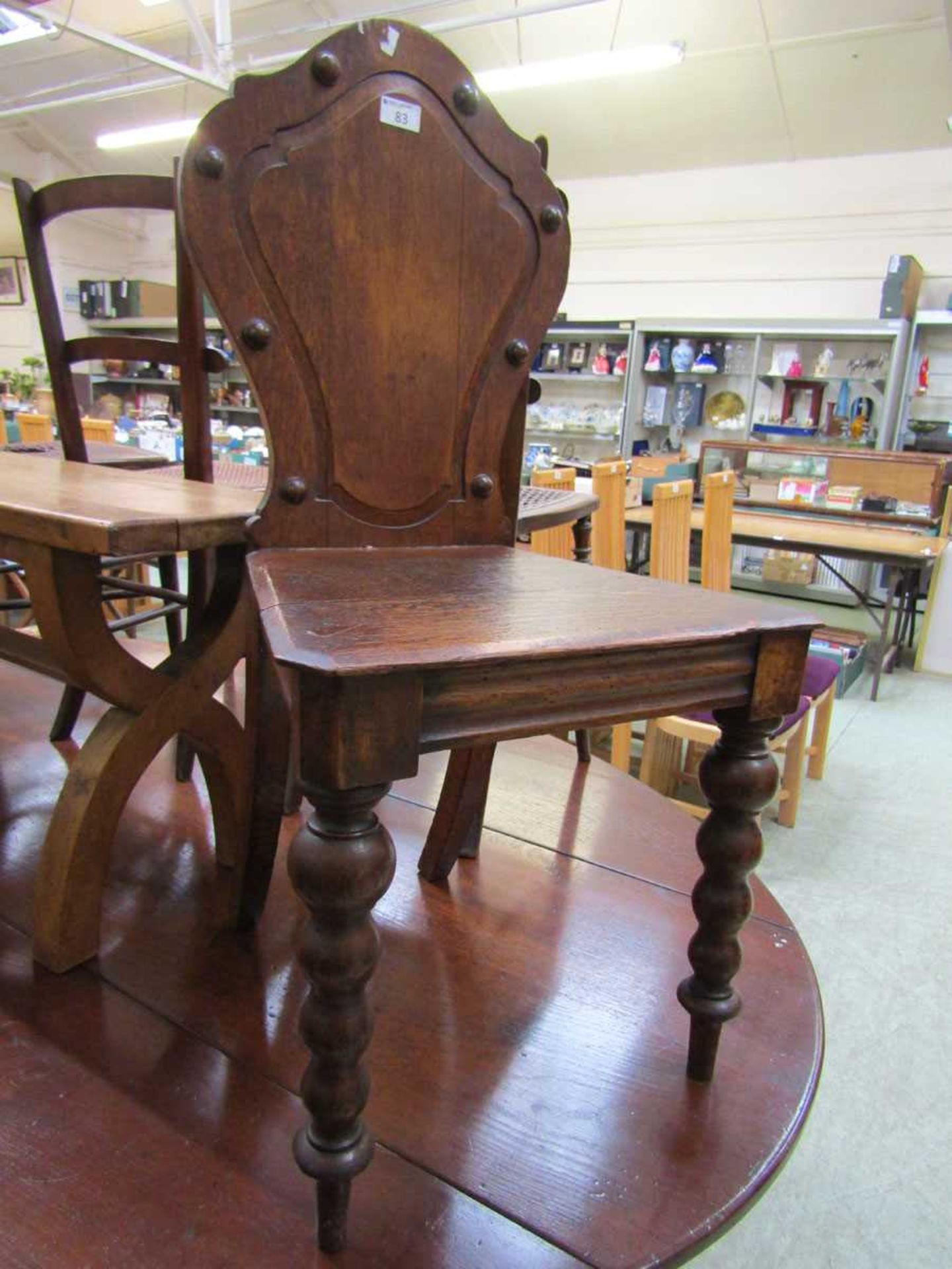 A Victorian shield back oak hall chair