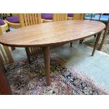 A modern elm effect oval occasional table by Dunelm 'Elements' Damage to end of table. One corner