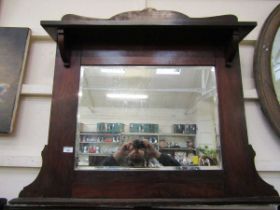 An early 20th century stained pine over mantle mirror