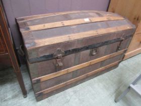 A fibre banded dome topped early 20th century travelling trunk