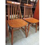 A pair of mid-20th century spindle back dining chairs
