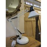 A reproduction white angle poise style lamp