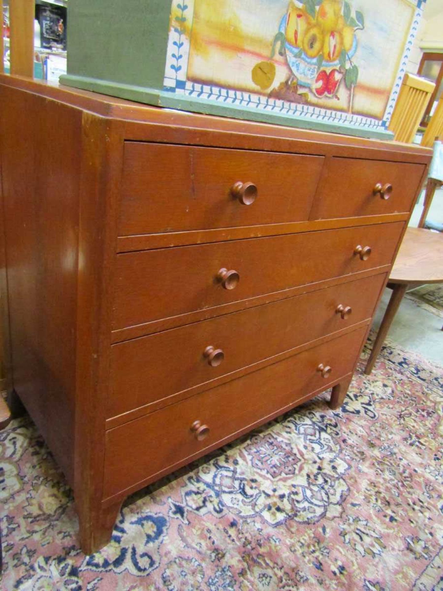 A mid-20th century chest of two short over three long drawers