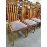 Three modern beech effect high back dining chairs