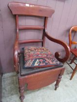 A Victorian mahogany commode chair