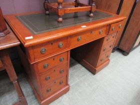 A small 19th century oak pedestal desk with tooled leather writing surface, 107cm wide