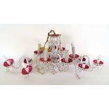A mid 20th century Bohemia cranberry and white overlay glass six branch chandelier with a pair of