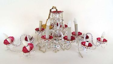 A mid 20th century Bohemia cranberry and white overlay glass six branch chandelier with a pair of