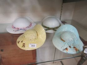 Four ceramic wall pockets in the form of ladies' sun hats