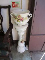 An Italian pottery jardinière on stand with floral encrustations, 96.5cm tall