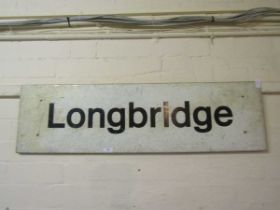 An enamelled sign for Longbridge 102cm wide x 29cm tall