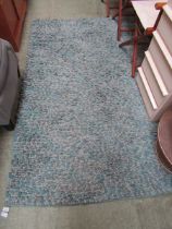 A modern blue wool rectangular rug