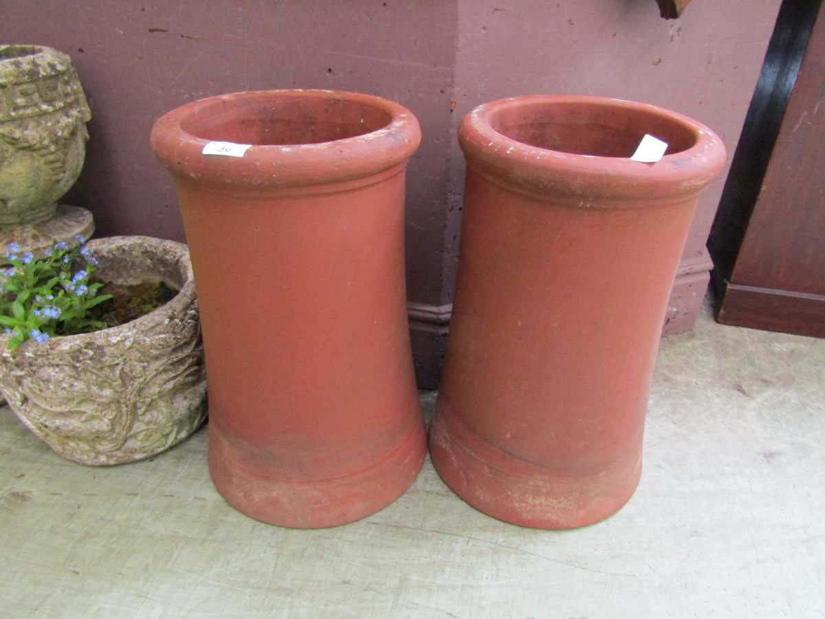 A pair of terracotta garden chimney pot planters, 46cm tall