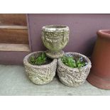 A pair and a single reconstituted stone garden planters