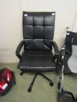 A swivel office arm chair