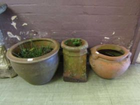 A Grecian style terracotta planter, a large stoneware planter, and a chimney pot planter