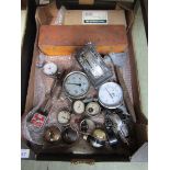 A tray containing early 20th century pressure gauges, switches, etc