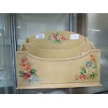 A floral decorated letter rack