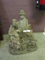 Two weathered stoneware garden ornaments of lady and gent on benches