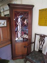 An early 20th century mahogany free standing corner cupboard, 193.5cm tall