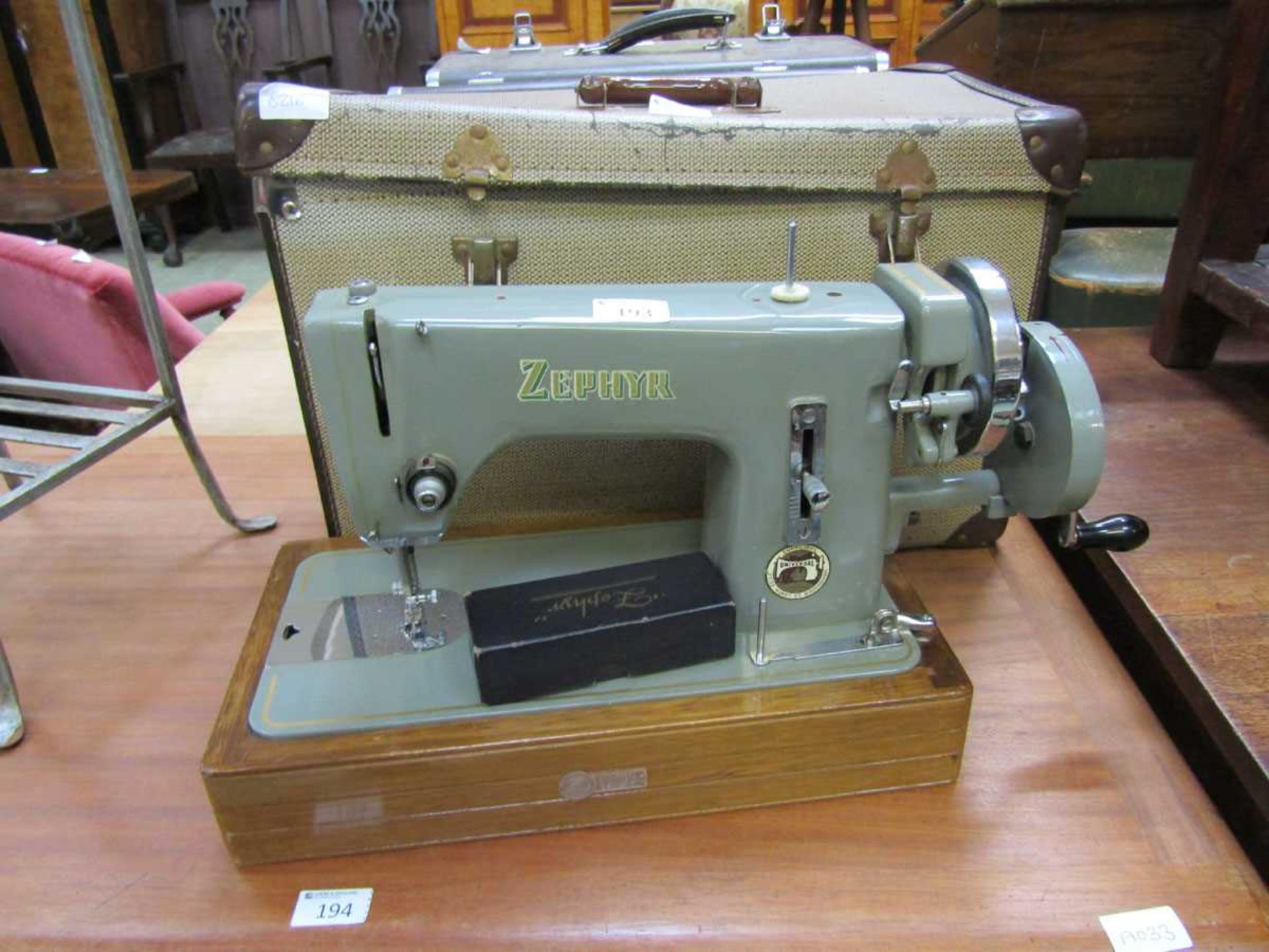 A cased Zephyr manual sewing machine