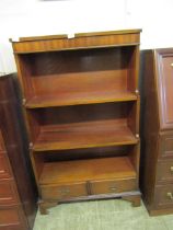 A mid-20th century G Plan mahogany fall front waterfall bookcase with two drawers to base