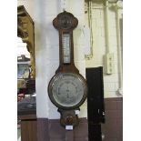 An early 20th century oak banjo barometer by James Lucking and Co Ltd of Birmingham