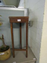 An early 20th century stained oak plant stand