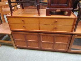 A mid-20th century Nathan 'Squares' teak cabinet having four drawers above two cupboard doors