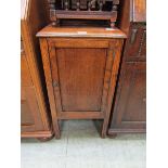 An early 20th century oak pot cupboard