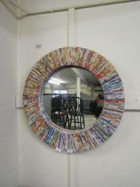 A circular wall mirror constructed from colourful rolls of paper Overall good condition, no damage