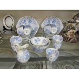 An assortment of blue and white Granger tableware to include cake plates, cups, saucers, bowls, etc
