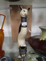 A cat design decanter and stand designed by Ann Richmond for 'Things We Love'