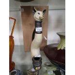 A cat design decanter and stand designed by Ann Richmond for 'Things We Love'