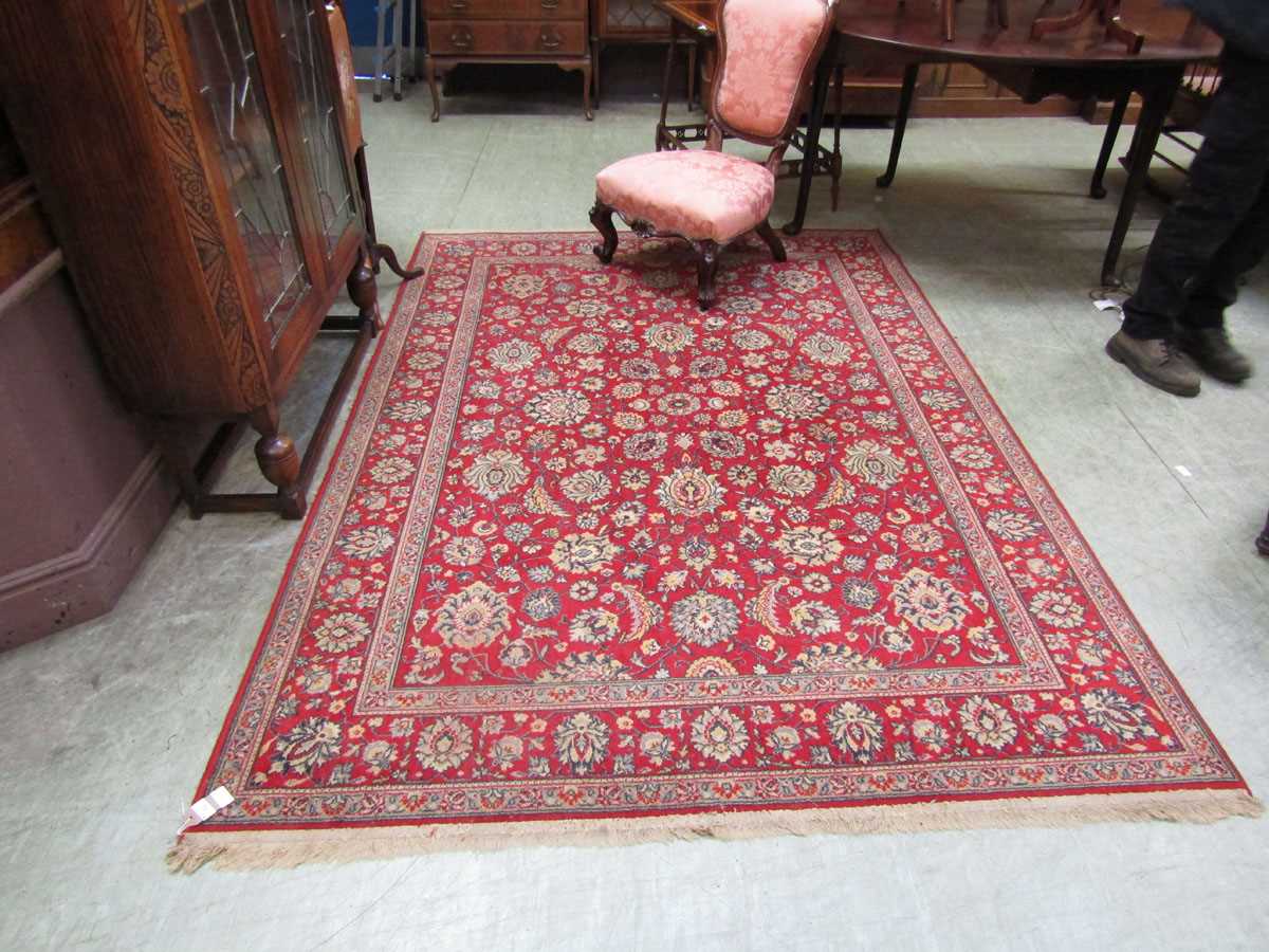 A rectangular red ground rug