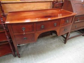 A Victorian mahogany bow fronted sideboard having a centre drawer flanked by two further drawers