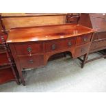 A Victorian mahogany bow fronted sideboard having a centre drawer flanked by two further drawers