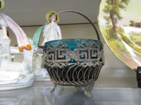 A 20th century silver plated wirework basket containing a blue glass bowl