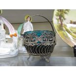 A 20th century silver plated wirework basket containing a blue glass bowl