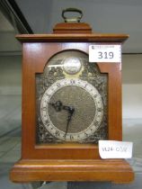 A mahogany cased mantel clock by Tempus Fugit