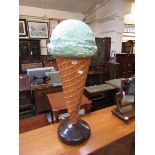 A moulded over sized ice cream cone