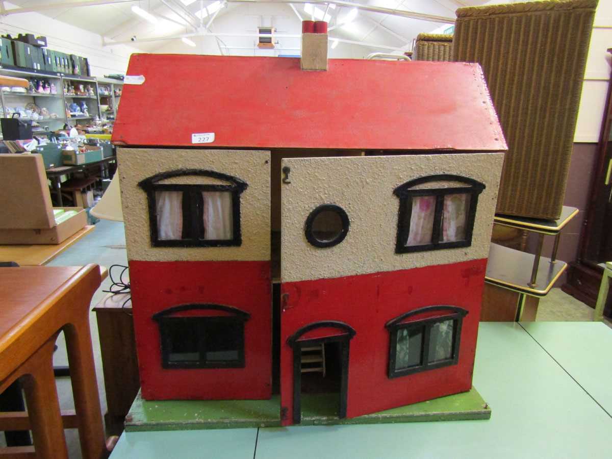 A mid-20th century painted doll's house