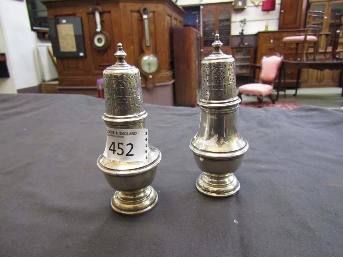 Two silver hallmarked pepper pots, approx. weight 147g