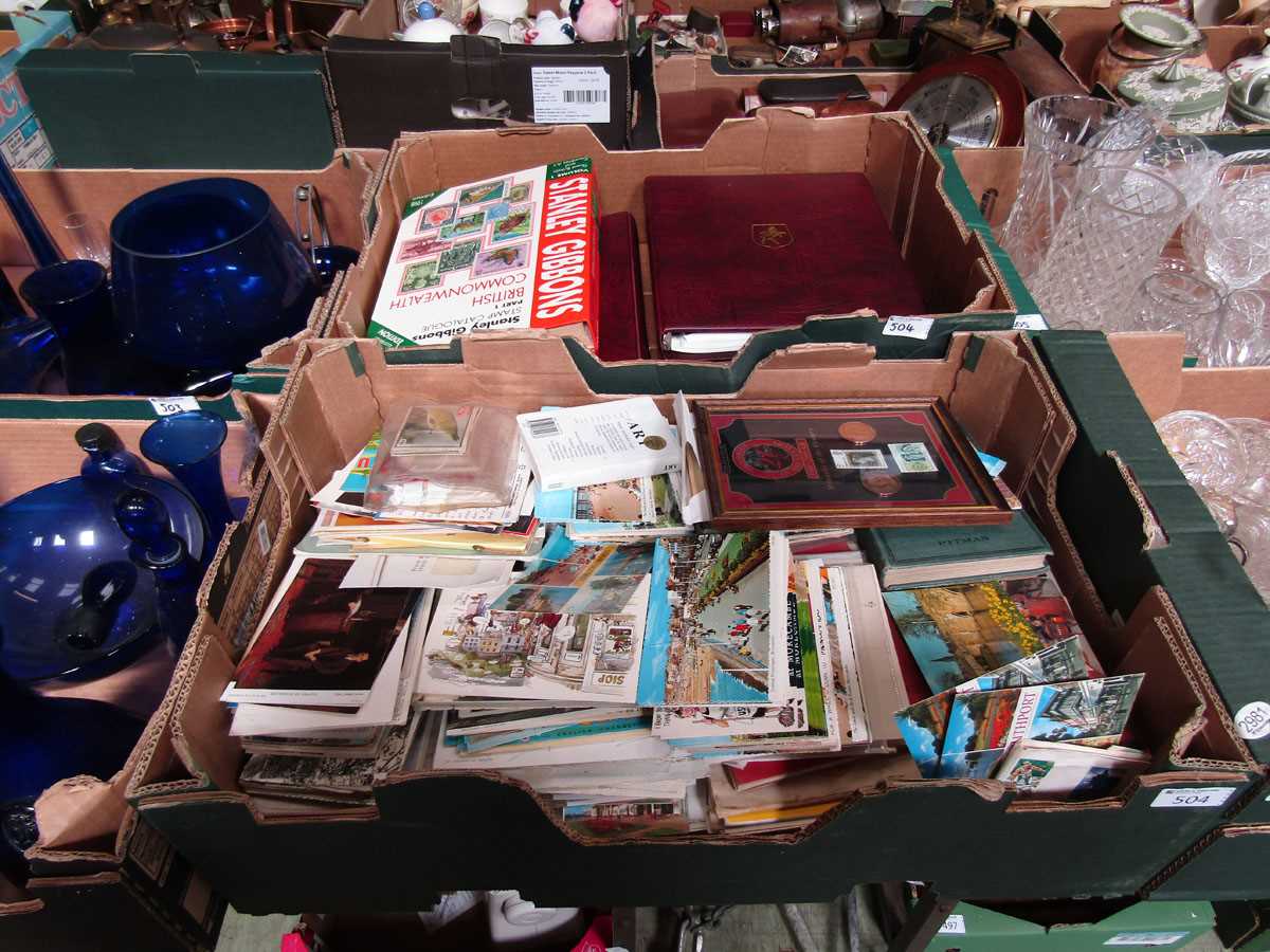 Two trays containing old postcards, stamp albums, etc