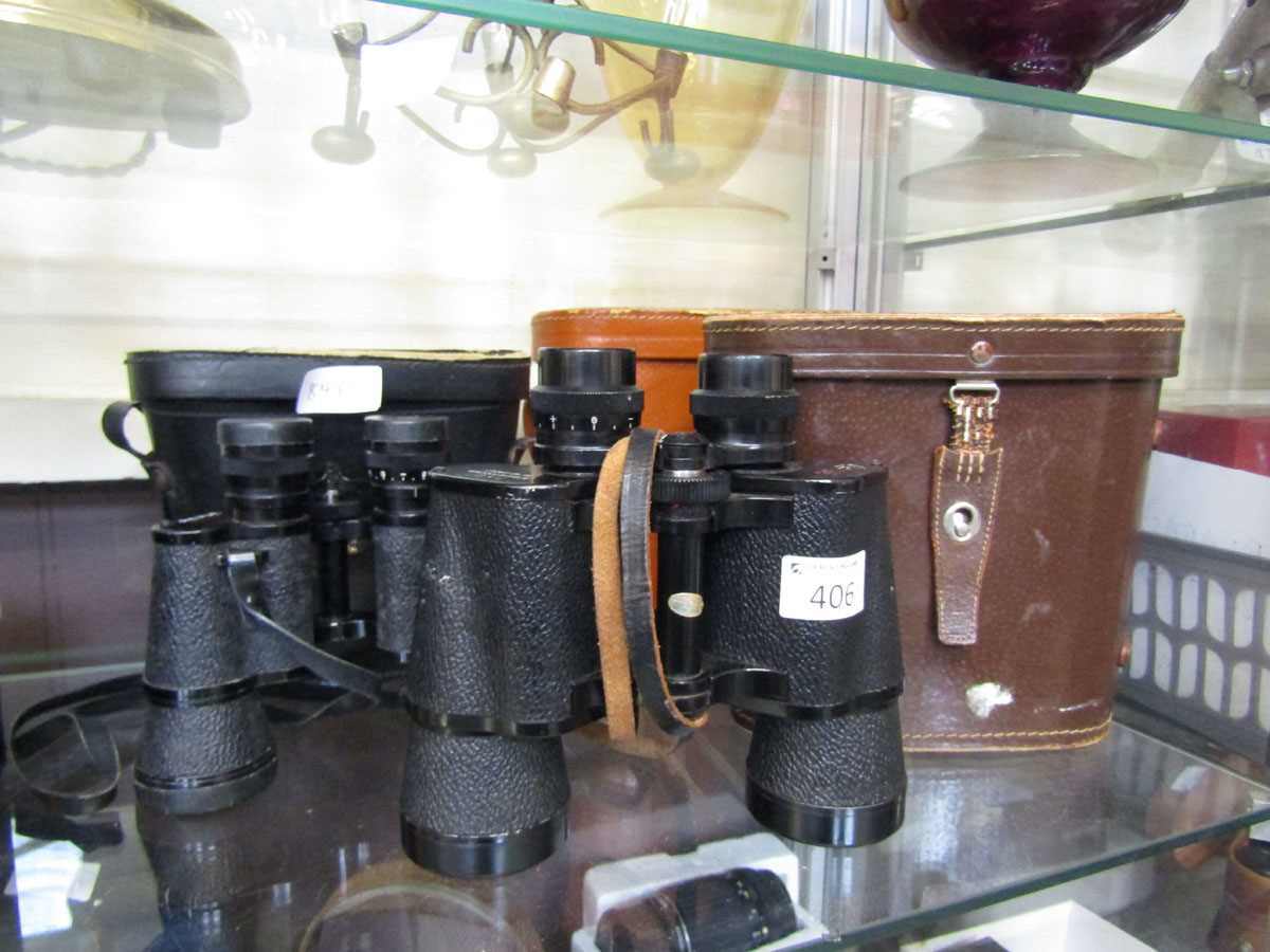 Three pairs of cased binoculars to include Swallow, Revue, etc